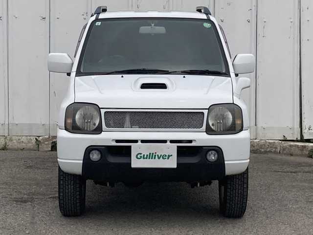 スズキ ジムニー XC 埼玉県 2003(平15)年 13.6万km スペリアホワイト ４ＷＤ/ターボ/スズキスポーツマフラー/ヒーテッドドアミラー/社外ＭＯＭＯステアリング/社外１６inアルミホイール/ルーフレール/電動格納ミラー/ＡＢＳ/ドアバイザー/フロアマット/新車保証書/取扱説明書