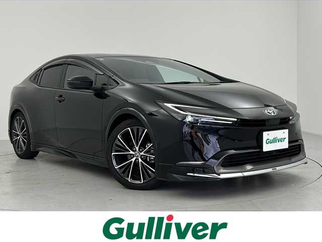 トヨタ プリウス Z 愛知県 2023(令5)年 1.1万km アティチュードブラックマイカ 禁煙車/純正12.3インチディスプレイオーディオ/フルセグTV/Bluetooth/全方位カメラ/バックカメラ/ブラインドスポットモニター/ビルトインETC2.0/衝突被害軽減システム/クリアランスソナー/パーキングアシスト/レーンキープアシスト/横滑り防止装置/レーダークルーズコントロール/LEDヘッドライト/フォグランプ/オートライト/オートマチックハイビーム/合皮シート/前席シートヒーター/前席エアシート/運転席パワーシート/運転席シートメモリ/パワーバックドア/ワイヤレス充電/エンジンスタートボタン/スマートキー/純正フロアマット/純正19インチアルミホイール/MODELLISTA製エアロ(フロント、サイド、リア)