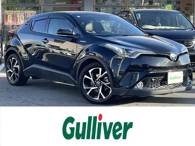 トヨタ Ｃ－ＨＲ G 長野県 2018(平30)年 7.7万km ブラック 純正SDナビ(AM/FM/BT/DVD/CD/TV)/バックカメラ/純正AW/クルーズコントロール(追従あり)/ETC/純正ドアバイザー/ハーフレザーシート/LEDヘッドライト/ABS/横滑り防止装置/衝突軽減システム/オートライト/オートハイビーム/BSM/フォグランプ/取説/保証書/記録簿
