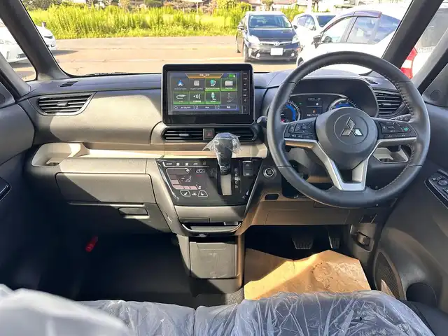 三菱 デリカミニ T プレミアム 宮城県 2025(令7)年 0.1千km アメジストブラック T　PREMIUM　4WD　/サイドデカール/＝＝＝/e-Assist/・衝突被害軽減ブレーキ/・踏み間違い衝突防止アシスト/・車線逸脱警報システム/・車線逸脱防止支援機能/・オートマチックハイビーム/・ふらつき警報/・前方衝突予測警報/・標識検知システム/・先行車発進通知/マイパイロット（レーダークルーズコントロール/車線維持支援）/デジタルルームミラー/マルチアラウンドモニター/純正9型ディスプレイオーディオ/・Bluetooth/・AppleCarPlay/AndroidAuto/ハンズフリー両側パワースライドドア/ハーフレザーシート/シートヒーター/ステアリングヒーター/革巻きステアリング/ステアリングスイッチ/パドルシフト/電動パーキングブレーキ/ブレーキホールド/LEDヘッドランプ/フォグランプ/オートライト/スマートキー＆プッシュスタート/スペアキー/電動格納ミラー/ルーフレール/純正15インチAW/W/サイド/カーテンエアバッグ