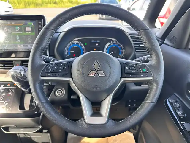 三菱 デリカミニ T プレミアム 宮城県 2025(令7)年 0.1千km アメジストブラック T　PREMIUM　4WD　/サイドデカール/＝＝＝/e-Assist/・衝突被害軽減ブレーキ/・踏み間違い衝突防止アシスト/・車線逸脱警報システム/・車線逸脱防止支援機能/・オートマチックハイビーム/・ふらつき警報/・前方衝突予測警報/・標識検知システム/・先行車発進通知/マイパイロット（レーダークルーズコントロール/車線維持支援）/デジタルルームミラー/マルチアラウンドモニター/純正9型ディスプレイオーディオ/・Bluetooth/・AppleCarPlay/AndroidAuto/ハンズフリー両側パワースライドドア/ハーフレザーシート/シートヒーター/ステアリングヒーター/革巻きステアリング/ステアリングスイッチ/パドルシフト/電動パーキングブレーキ/ブレーキホールド/LEDヘッドランプ/フォグランプ/オートライト/スマートキー＆プッシュスタート/スペアキー/電動格納ミラー/ルーフレール/純正15インチAW/W/サイド/カーテンエアバッグ