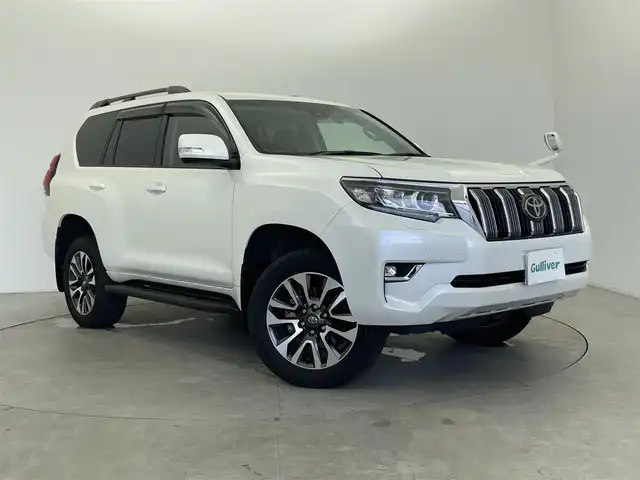トヨタ ランドクルーザー プラド TX Lパッケージ 富山県 2023(令5)年 2.3万km ホワイトパールクリスタルシャイン 純正ナビ（AM/FM/DVD/BT/フルセグ）/バックカメラ/ドライブレコーダー/ETC/レザーシート/D/N席パワーシート/シートヒーター/シートベンチレーション/衝突被害軽減システム/レーダークルーズコントロール/レーンキープアシスト/コーナーセンサー/横滑り防止装置/オートLEDライト/純正アルミホイール/純正フロアマット/ドアバイザー/革巻きステアリング/ステアリングスイッチ/スマートキー