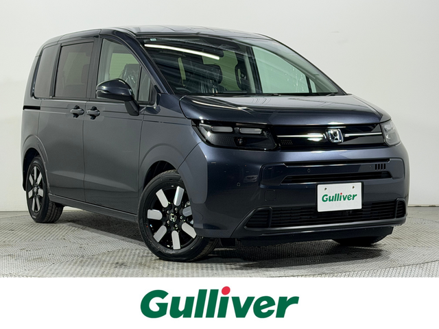 ホンダ フリード ハイブリット e:HEV AIR EX 大阪府 2025(令7)年 0.1千km メテオロイドグレーメタリック 純正9インチナビ　バックカメラ　Bluetooth　フルセグTV ホンダセンシング　レーダークルーズ　BSM シートヒーター　両側パワースライドドア　オートライト　LEDヘッドライト　スマートキー2本