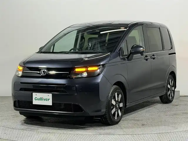 ホンダ フリード ハイブリット e:HEV AIR EX 大阪府 2025(令7)年 0.1千km メテオロイドグレーメタリック 純正9インチナビ　バックカメラ　Bluetooth　フルセグTV ホンダセンシング　レーダークルーズ　BSM シートヒーター　両側パワースライドドア　オートライト　LEDヘッドライト　スマートキー2本