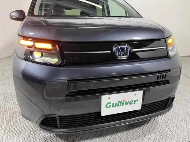 ホンダ フリード ハイブリット e:HEV AIR EX 大阪府 2025(令7)年 0.1千km メテオロイドグレーメタリック 純正9インチナビ　バックカメラ　Bluetooth　フルセグTV ホンダセンシング　レーダークルーズ　BSM シートヒーター　両側パワースライドドア　オートライト　LEDヘッドライト　スマートキー2本