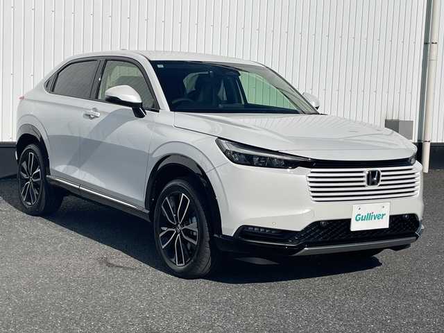 ホンダ ヴェゼル ハイブリッド e:HEV Z 千葉県 2025(令7)年 0.1千km プラチナホワイトパール 純正９インチコネクトナビ/(フルセグTV/BT/AppleCarPlay/AndroidAuto)/ブラインドスポットモニター/衝突被害軽減システム/車線逸脱警報/バックカメラ/クルーズコントロール/電動リアゲート/ハーフレザーシート/横滑り防止装置/ビルトインETC2.0/ワイヤレス充電/LEDヘッドライト/フォグランプ/オートライト/ウィンカーミラー/電動格納ミラー/純正18インチAW/シートヒーター/シートリフター/プッシュスタート/スマートキー/スペアキー/取扱説明書/保証書