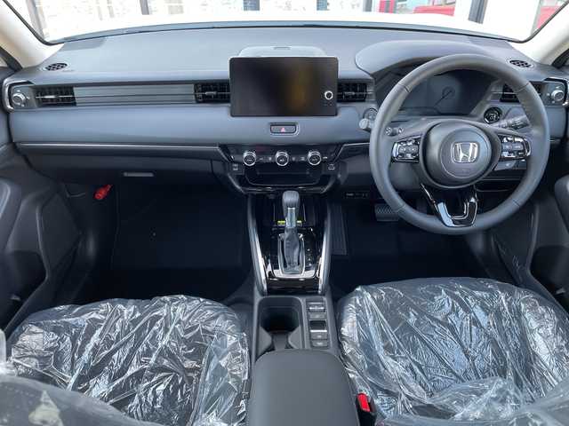 ホンダ ヴェゼル ハイブリッド e:HEV Z 千葉県 2025(令7)年 0.1千km プラチナホワイトパール 純正９インチコネクトナビ/(フルセグTV/BT/AppleCarPlay/AndroidAuto)/ブラインドスポットモニター/衝突被害軽減システム/車線逸脱警報/バックカメラ/クルーズコントロール/電動リアゲート/ハーフレザーシート/横滑り防止装置/ビルトインETC2.0/ワイヤレス充電/LEDヘッドライト/フォグランプ/オートライト/ウィンカーミラー/電動格納ミラー/純正18インチAW/シートヒーター/シートリフター/プッシュスタート/スマートキー/スペアキー/取扱説明書/保証書