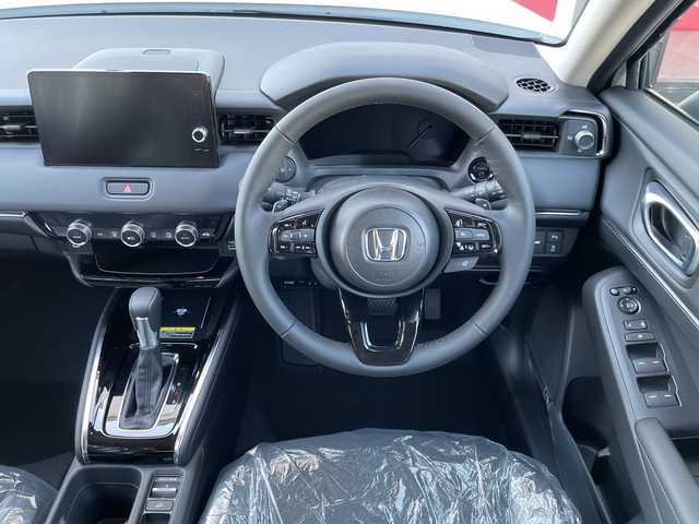 ホンダ ヴェゼル ハイブリッド e:HEV Z 千葉県 2025(令7)年 0.1千km プラチナホワイトパール 純正９インチコネクトナビ/(フルセグTV/BT/AppleCarPlay/AndroidAuto)/ブラインドスポットモニター/衝突被害軽減システム/車線逸脱警報/バックカメラ/クルーズコントロール/電動リアゲート/ハーフレザーシート/横滑り防止装置/ビルトインETC2.0/ワイヤレス充電/LEDヘッドライト/フォグランプ/オートライト/ウィンカーミラー/電動格納ミラー/純正18インチAW/シートヒーター/シートリフター/プッシュスタート/スマートキー/スペアキー/取扱説明書/保証書