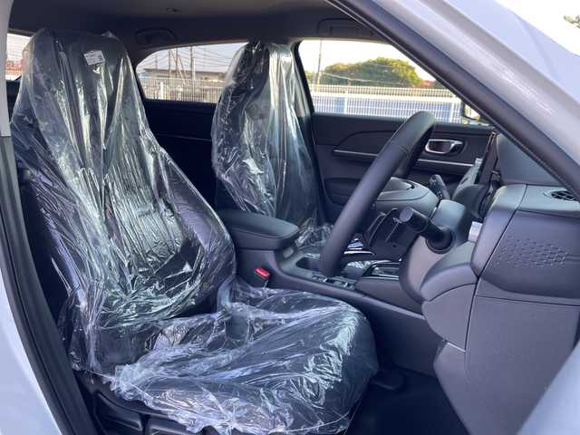 ホンダ ヴェゼル ハイブリッド e:HEV Z 千葉県 2025(令7)年 0.1千km プラチナホワイトパール 純正９インチコネクトナビ/(フルセグTV/BT/AppleCarPlay/AndroidAuto)/ブラインドスポットモニター/衝突被害軽減システム/車線逸脱警報/バックカメラ/クルーズコントロール/電動リアゲート/ハーフレザーシート/横滑り防止装置/ビルトインETC2.0/ワイヤレス充電/LEDヘッドライト/フォグランプ/オートライト/ウィンカーミラー/電動格納ミラー/純正18インチAW/シートヒーター/シートリフター/プッシュスタート/スマートキー/スペアキー/取扱説明書/保証書