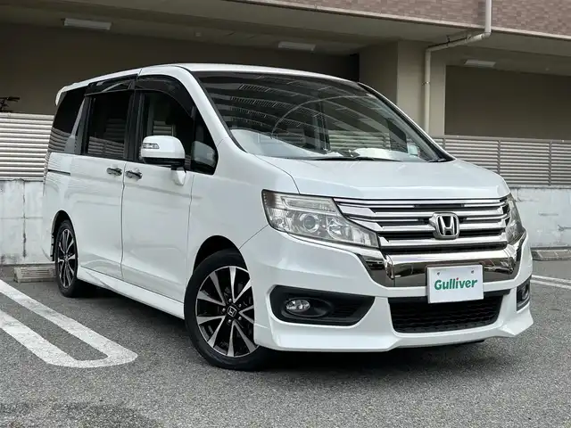 ホンダ ステップワゴン スパーダ Z クールスピリット 大阪府 2013(平25)年 9.7万km ホワイトオーキッドパール ワンオーナー/純正Gathers 9インチナビ　(VXM-135VFNi)/・バックカメラ/・フルセグテレビ（走行中視聴可能）/・CD/DVD/・Bluetooth/・AM/FM/両側パワースライドドア/クルーズコントロール/ドライブレコーダー（DRV-320）/ビルトインETC/オートライト/横滑り防止装置/革巻きステアリング/パドルシフト（MTモード付AT)/ハーフレザーシート/純正フロアマット/純正17インチアルミホイール/スペアキー1本