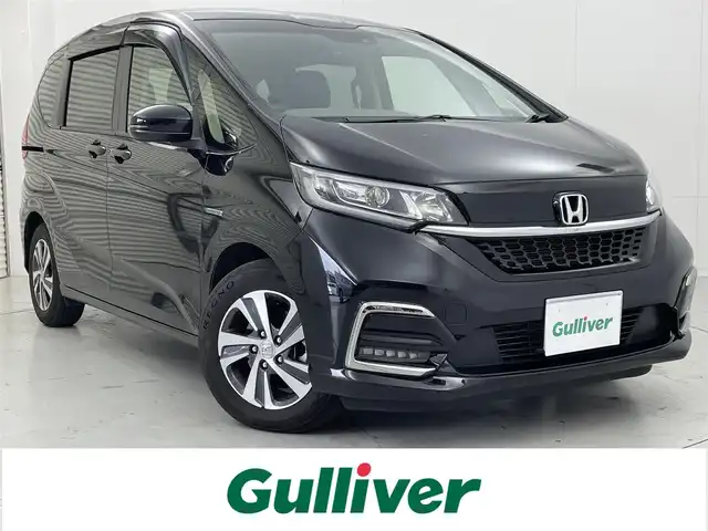 ホンダ フリード ハイブリット G ホンダセンシング 茨城県 2022(令4)年 3.9万km クリスタルブラックパール 純正ナビ/バックカメラ/フルセグ/衝突被害軽減ブレーキ/車線逸脱抑制装置/レーダークルーズコントロール/両側電動スライドドア/ETC/ドラレコ/シートヒーター/純正15インチAW/LEDヘッドライト/スマートキー