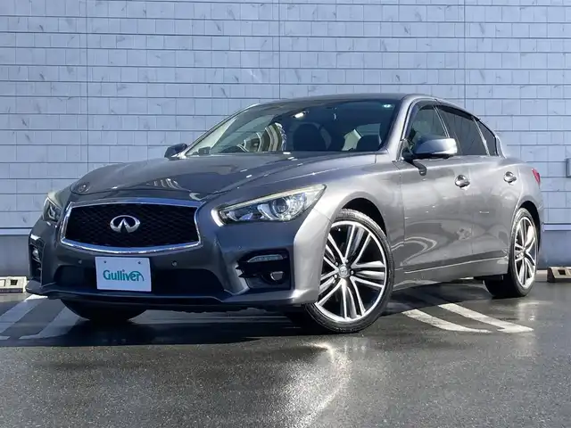 日産 スカイライン 200GT－t タイプSP 静岡県 2015(平27)年 8.1万km ダークメタルグレー エマージェンシーブレーキ/純正メーカーナビ/　AM FM CD DVD Bluetooth USB AUX/フルセグTV/ビルトインETC/前後方ドライブレコーダー/レーダークルーズコントロール/LEDオートヘッドランプ/パワーシート(前席)/シートヒーター(前席)/前後方クリアランスソナー/純正19インチアルミホイール/スマートキー2本/シングルサンルーフ/アラウンドビューモニター/ブラックレザーシート