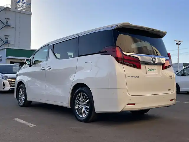 トヨタ アルファードハイブリット G Fパッケージ 東京都 2022(令4)年 6.1万km ホワイトパールクリスタルシャイン 純正10.5型ナビ/（CD/DVD/BT/USB）/全周囲カメラ/純正13.1インチフリップダウンモニター/JBLサウンド/純正ビルトインETC2.0/プリクラッシュセーフティ/クリアランスソナー/レーントレーシングアシスト/リヤクロストラフィックアラート/ブラインドスポットモニター/パーキングサポートブレーキ/デジタルインナーミラー/前後ドライブレコーダー/両側パワースライドドア/純正フロアマット/LEDヘッドライト/フロントフォグランプ/運転席メモリ付きパワーシート/前席シートヒーター/パワーバックドア