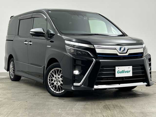 トヨタ ヴォクシー ハイブリッド ZS 煌 三重県 2018(平30)年 4.9万km ブラック /禁煙車//純正１０型ナビ(フルセグ/CD/DVD/BT/AM/FM)　//１２．８型フリップダウンモニター //バックカメラ //フロントカメラ//両側パワースライドドア//ドラレコ前後//シートヒーター //トヨタセーフティーセンス //クルコン //レーンキープアシスト //オートマチックハイビーム //LEDヘッドライト//ビルトインETC//ステアリングスイッチ