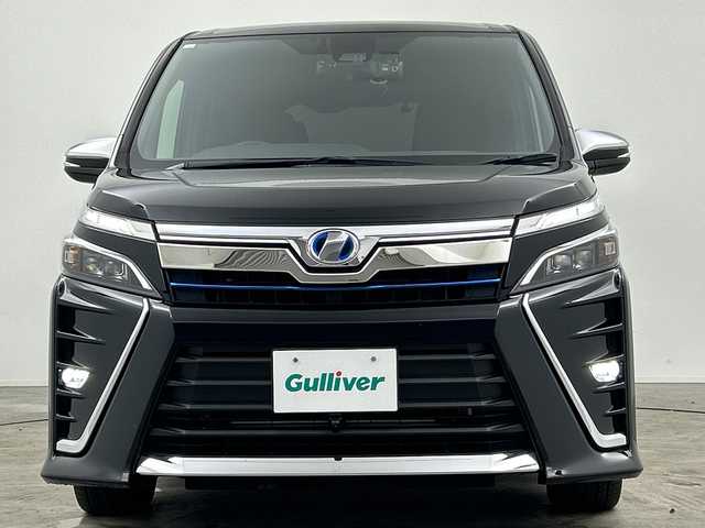 トヨタ ヴォクシー ハイブリッド ZS 煌 三重県 2018(平30)年 4.9万km ブラック /禁煙車//純正１０型ナビ(フルセグ/CD/DVD/BT/AM/FM)　//１２．８型フリップダウンモニター //バックカメラ //フロントカメラ//両側パワースライドドア//ドラレコ前後//シートヒーター //トヨタセーフティーセンス //クルコン //レーンキープアシスト //オートマチックハイビーム //LEDヘッドライト//ビルトインETC//ステアリングスイッチ