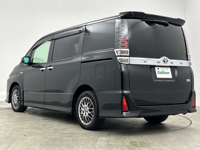 トヨタ ヴォクシー ハイブリッド ZS 煌 三重県 2018(平30)年 4.9万km ブラック /禁煙車//純正１０型ナビ(フルセグ/CD/DVD/BT/AM/FM)　//１２．８型フリップダウンモニター //バックカメラ //フロントカメラ//両側パワースライドドア//ドラレコ前後//シートヒーター //トヨタセーフティーセンス //クルコン //レーンキープアシスト //オートマチックハイビーム //LEDヘッドライト//ビルトインETC//ステアリングスイッチ