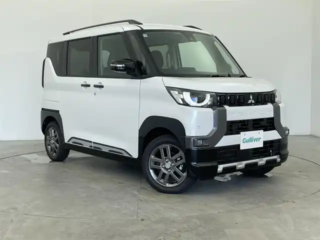 三菱 デリカミニ T プレミアム 富山県 2025(令7)年 0.1千km アメジストブラック/シルキーホワイト 純正9型ディスプレイオーディオ（AM/FM/BT）/全方位カメラ/デジタルインナーミラー/両側パワースライドドア/オートホールド付電子パーキング/ハーフレザーシート/シートヒーター/ハンドルヒーター/衝突被害軽減システム/レーダークルーズコントロール/レーンキープアシスト/コーナーセンサー/横滑り防止装置/アイドリングストップ/純正アルミホイール/オートLEDライト/革巻きステアリング/ステアリングスイッチ/パドルシフト/スマートキー/スペアキー