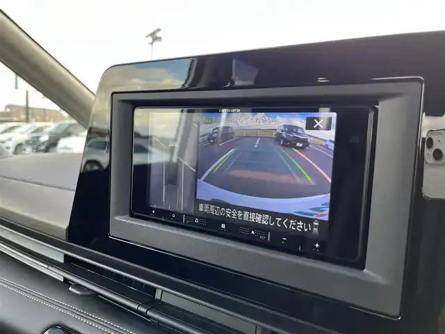 日産 セレナ ハイウェイスター V 鳥取県 2024(令6)年 1.2万km プリズムホワイト ４・W・D/社外ナビ/フルセグ/」BT/USB/アラウンドビューモニター/エマージェンシーブレーキ/レーダークルーズコントロール/両側パワースライド/電動パーキングブレーキ/LEDヘットライト/純正16インチアルミホイール/プッシュエンジンスタート/アイドリングストップ/フロアマット/ドアバイザー/保証書/取扱説明書/スペアキー