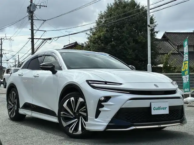 トヨタ クラウン スポーツ Z 熊本県 2024(令6)年 0.1万km プレシャスホワイトパール ワンオーナー/パノラマルーフ/モデリスタエアロ（F.S.R）/純正ナビ機能付きディスプレーオーディオ/【フルセグTV/Bluetooth】/全方囲カメラ/バックカメラ/デジタルインナーミラー/トヨタチームメイト/アドバンストパーク/レーダークルーズコントロール/衝突被害軽減システム/ヘッドアップディスプレイ/コーナーセンサー/純正21インチAW/ビルトインETC2.0/オートLEDヘッドライト/オートハイビーム/ウィンカーミラー/黒革シート/前席シートヒーター/エアシート/ステアリングヒーター/ワイヤレス充電器/プッシュスタート/ステアリングスイッチ/純正フロアマット/純正ドアバイザー/横滑り防止/盗難防止装置/保証書/取扱説明書