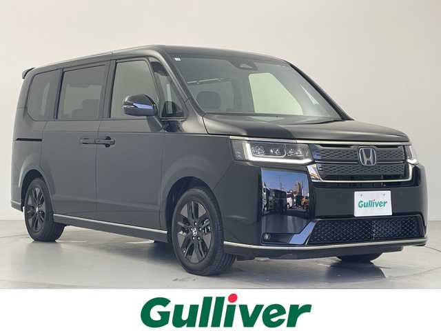 ホンダ ステップワゴン スパーダ eHEV 愛知県 2025(令7)年 0.1万km クリスタルブラックパール 11インチナビ/Bluetooth/ホンダセンシング /レーダークルーズコントロール/パドルシフト/オートライト/LEDライト/シートヒーター（D/N）/両側パワースライドドア/パワーバックドア/スマートキー