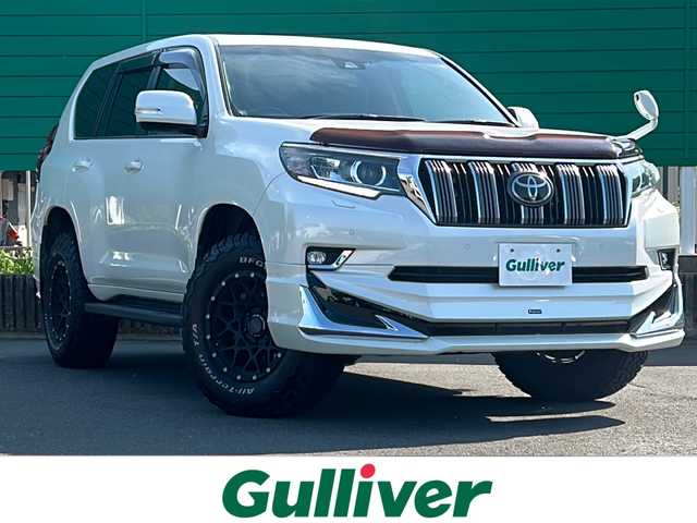 トヨタ ランドクルーザー プラド TX Lパッケージ 茨城県 2020(令2)年 5.5万km ホワイトパールクリスタルシャイン モデリスタエアロ/ムーンルーフ/ALPINE製後席ヘッドレストモニター/ALPINEフローティングナビ/CD/DVD/Bluetooth/フルセグTV/バックカメラ/トヨタセーフティセンス/・プリクラッシュセーフティ/・レーンディパーチャーアラート/・オートマチックハイビーム/・レーダークルーズコントロール/・ロードサインアシスト/先行者発進告知/ビルトインETC/前席パワーシート/前席シートヒーター/エアシート/RAYS製AW/純正19インチAW付きスタッドレスタイヤ4本あり 5mm/オートライト/LEDヘッドライト/社外ヒッチメンバー/airplexバグガード
