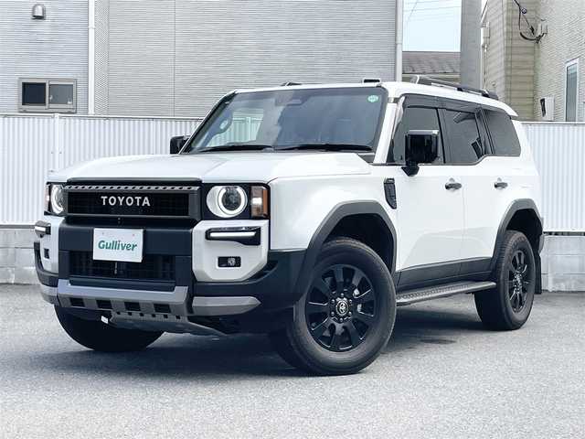 トヨタ ランドクルーザー ２５０ VX ファーストエディション 栃木県 2024(令6)年 1.1万km プラチナホワイトパールマイカ ワンオーナー/F.Rモデリスタエアロ/トヨタセーフティセンス/・プリクラッシュセーフティ/・レーンディパーチャーアラート/・ブラインドスポットモニター/・プロアクティブドライビングアシスト/・クリアランスソナー/・リヤクロストラフィックアラート/・リヤカメラディテクション/・ロードサインアシスト/・レーダークルーズコントロール/純正ナビ/・フルセグTV/・Bluetooth/・AppleCarPlay/AndroidAuto/・FM/AM/USB/HDMI/・Miracast/サンルーフ/パノラミックビューモニター/デジタルインナーミラー/ルーフレール/ビルトインETC2.0/パワーバックドア/革巻きステアリング/ステアリングスイッチ/ステアリングヒーター/ブラウンレザーシート/前席シートヒーター/前席シートベンチレーション/運転席パワーシート/電子パーキング/ブレーキオートホールド/LEDヘッドライト/フォグランプ/オートライト/オートマチックハイビーム/純正18インチAW/純正フロアマット/純正ドアバイザー/取扱説明書/保証書/スペアキー１