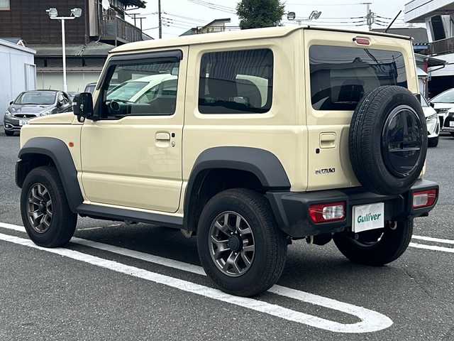 スズキ ジムニー シエラ JC 東京都 2024(令6)年 1.4万km シフォンアイボリーM ワンオーナー/4WD/クルーズコントロール/レーンアシスト/横滑り防止装置/盗難防止装置/衝突被害軽減システム/ダウンヒルアシストコントロール/15インチ純正アルミホイール/ETC/取扱説明書/保証書/スペアキー1本
