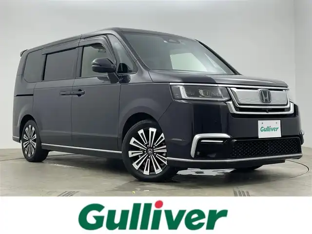 ホンダ ステップワゴン スパーダ eHEV プレミアムライン 岡山県 2022(令4)年 2.3万km トワイライトミストブラックパール 純正１１.4インチディスプレイオーディオ/（Bluetooth/フルセグTV/DVD/CD）/合皮ハーフレザー/オートハイビーム/衝突軽減ブレーキ/レーダークルーズコントロール/アラウンドビューモニター/ビルトインＥＴＣ/ＬＥＤヘッドライト/シートヒーター/純正ドライブレコーダー/オプションフロントグリル/USB接続/パドルシフト/ブラインドスポットモニター/両側パワースライドドア/取扱説明書/新車保証書/スマートキー×２