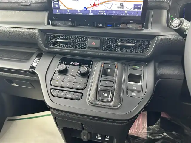 ホンダ ステップワゴン スパーダ eHEV プレミアムライン 佐賀県 2022(令4)年 2.3万km トワイライトミストブラックパール 純正11.4型ナビゲーション/・AM/FM/CD/DVD/フルセグ/BT//・Appple Car Play/Android Auto//・アラウンドビューモニター/社外グリル/純正グリル車載/両側パワースライドドア/後席サンシェード/後席USB入力端子/後席マルチテーブル/シートヒーター「前席/セカンドシート」/ハーフレザーシート/LEDヘッドライト/・オートマチックハイビーム/スマートキー/純正17インチアルミホイール/純正フロアマット/純正ドアバイザー/新車保証書/取扱説明書/スペアキー1本/Honda SENSING/・衝突軽減ブレーキ（CMBS）/・誤発進抑制機能（前方・後方）/・後方誤発進抑制機能/・歩行者事故低減ステアリング/・路外逸脱抑制機能/・車線維持支援システム（LKAS）/・アダプティブ・クルーズ・コントロール/・トラフィックジャムアシスト（渋滞追従支援機能）/・標識認識機能/・ブラインドスポットインフォメーション（後側方車両検知）/・後退出庫サポート/・パーキングセンサーシステム（前後）