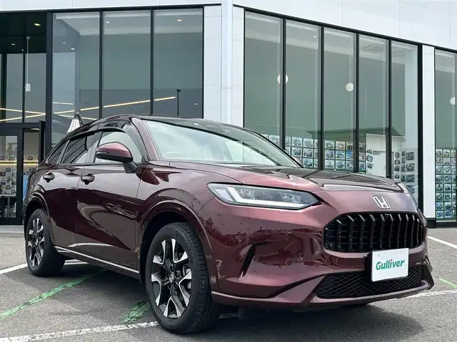ホンダ ＺＲ－Ｖ ハイブリッド e:HEV Z 長崎県 2022(令4)年 1.4万km アーバンチタニウムメタリック 純正9型ナビ/フルセグTV/ハンズフリーパワーバックドア/マルチビューカメラシステム/ビルトインETC2.0/ドライブレコーダー/渋滞追従機能付アダプティブクルーズコントロール/ソナーセンサー/ホンダセンシング/・衝突軽減ブレーキ/・誤発進抑制機能(前後)/・近距離衝突軽減ブレーキ/・歩行者事故低減ステアリング/・車線維持支援システム/・トラフィックジャムアシスト/・先行車発進お知らせ機能/・標識認識機能/・オートハイビーム/・ブラインドスポットインフォメーション/・後退出庫サポート/LEDヘッドランプ(オートレベリング機構)/本革巻きステアリング/ステアリングヒーター/パドルシフト/革シート/前席パワーシート/シートヒーター/運転席ドライビングポジションシステム/純正18インチアルミホイール/スマートキーシステム/BOSEプレミアムサウンドシステム