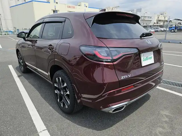 ホンダ ＺＲ－Ｖ ハイブリッド e:HEV Z 長崎県 2022(令4)年 1.4万km 赤Ｍ 純正9型ナビ/フルセグTV/ハンズフリーパワーバックドア/マルチビューカメラシステム/ビルトインETC2.0/ドライブレコーダー/渋滞追従機能付アダプティブクルーズコントロール/ソナーセンサー/ホンダセンシング/・衝突軽減ブレーキ/・誤発進抑制機能(前後)/・近距離衝突軽減ブレーキ/・歩行者事故低減ステアリング/・車線維持支援システム/・トラフィックジャムアシスト/・先行車発進お知らせ機能/・標識認識機能/・オートハイビーム/・ブラインドスポットインフォメーション/・後退出庫サポート/LEDヘッドランプ(オートレベリング機構)/本革巻きステアリング/ステアリングヒーター/パドルシフト/革シート/前席パワーシート/シートヒーター/運転席ドライビングポジションシステム/純正18インチアルミホイール/スマートキーシステム/BOSEプレミアムサウンドシステム/禁煙車