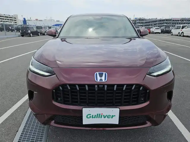ホンダ ＺＲ－Ｖ ハイブリッド e:HEV Z 長崎県 2022(令4)年 1.4万km 赤Ｍ 純正9型ナビ/フルセグTV/ハンズフリーパワーバックドア/マルチビューカメラシステム/ビルトインETC2.0/ドライブレコーダー/渋滞追従機能付アダプティブクルーズコントロール/ソナーセンサー/ホンダセンシング/・衝突軽減ブレーキ/・誤発進抑制機能(前後)/・近距離衝突軽減ブレーキ/・歩行者事故低減ステアリング/・車線維持支援システム/・トラフィックジャムアシスト/・先行車発進お知らせ機能/・標識認識機能/・オートハイビーム/・ブラインドスポットインフォメーション/・後退出庫サポート/LEDヘッドランプ(オートレベリング機構)/本革巻きステアリング/ステアリングヒーター/パドルシフト/革シート/前席パワーシート/シートヒーター/運転席ドライビングポジションシステム/純正18インチアルミホイール/スマートキーシステム/BOSEプレミアムサウンドシステム/禁煙車