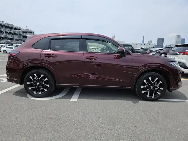 ホンダ ＺＲ－Ｖ ハイブリッド e:HEV Z 長崎県 2022(令4)年 1.4万km 赤Ｍ 純正9型ナビ/フルセグTV/ハンズフリーパワーバックドア/マルチビューカメラシステム/ビルトインETC2.0/ドライブレコーダー/渋滞追従機能付アダプティブクルーズコントロール/ソナーセンサー/ホンダセンシング/・衝突軽減ブレーキ/・誤発進抑制機能(前後)/・近距離衝突軽減ブレーキ/・歩行者事故低減ステアリング/・車線維持支援システム/・トラフィックジャムアシスト/・先行車発進お知らせ機能/・標識認識機能/・オートハイビーム/・ブラインドスポットインフォメーション/・後退出庫サポート/LEDヘッドランプ(オートレベリング機構)/本革巻きステアリング/ステアリングヒーター/パドルシフト/革シート/前席パワーシート/シートヒーター/運転席ドライビングポジションシステム/純正18インチアルミホイール/スマートキーシステム/BOSEプレミアムサウンドシステム/禁煙車