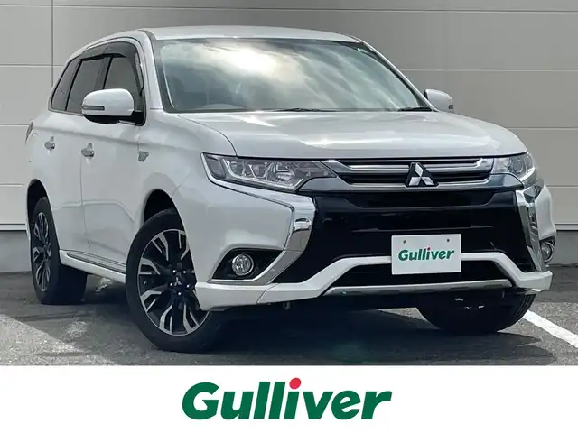 三菱 アウトランダー ＰＨＥＶ G セーフティパッケージ 岩手県 2015(平27)年 14.2万km シルキーホワイト 純正ナビ　ＣＤ／ＤＶＤ／Ｂｌｕｅｔｏｏｔｈ再生　フルセグ　バックＣ　全方位カメラ　純正１８ＡＷ　ＥＴＣ　Ｒクルコン　スマートキー　寒冷地　Ｐシート　Ｓヒーター　レーンキープ　パドルシフト　１００Ｖ