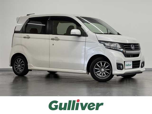 ホンダ Ｎ ＷＧＮ カスタム G Lパッケージ 三重県 2015(平27)年 6.9万km プレミアムホワイトパールⅡ ガソリン/FF/インパネCVT/純正 7インチナビ VXM-155VSi/（FM/AM/CD/DVD/USB/iPod/SD/Bluetooth/TV/VTR/AUX）/バックカメラ/ETC/安全/・近距離衝突軽減ブレーキ（CTBA）/・VSA（ABS、TCS、横すべり抑制）/・サイド＆カーテンエアバッグシステム/装備/・ハーフレザーシート/・クルーズコントロール/・オートライト/・ディスチャージヘッドライト（HID）/・フロントフォグライト/・ステアリングスイッチ/・オートエアコン/・電動格納ドアミラー/・プッシュスタート/・スマートキーx2/・後席シートベルトインジケーター（ルームミラー内蔵）/・純正14inAW/など