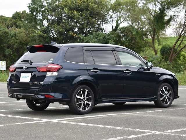 トヨタ カローラ フィールダー ハイブリッドG ダブルバイビー 大阪府 2019(令1)年 2.5万km ブラッキッシュアゲハガラスフレーク ワンオーナー/純正メモリナビ/フルセグTV・BT・CD・DVD・FM・AM/バックカメラ/ビルトインETC/トヨタセーフティセンス/・プリクラッシュセーフティ/・レーンディパーチャーアラート/・オートマチックハイビーム/・先行車発進お知らせ/クリアランスソナー/クルーズコントロール/純正LEDヘッドライト/革巻きステアリング/ハーフレザーシート/保証書・取説・スペアキー