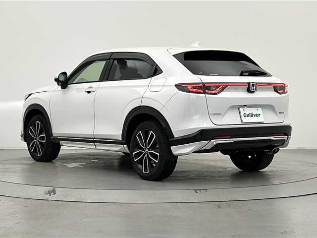 ホンダ ヴェゼル ハイブリッド e:HEV Z 宮城県 2022(令4)年 1.3万km プラチナホワイトパール 純正９インチナビ/（AM/FM/BT/Apple Car Play/Android Auto)/フルセグTV/レーダークルーズコントロール/パワーバックドア/前席シートヒーター/ステアリングヒーター/置くだけ充電/バックカメラ/ETC2.0/BSM/ハーフレザー/パドルシフト/前後コーナーセンサー/ダウンヒルアシストコントロール/LEDヘッドライト/純正18インチアルミホイール/純ドアバイザー