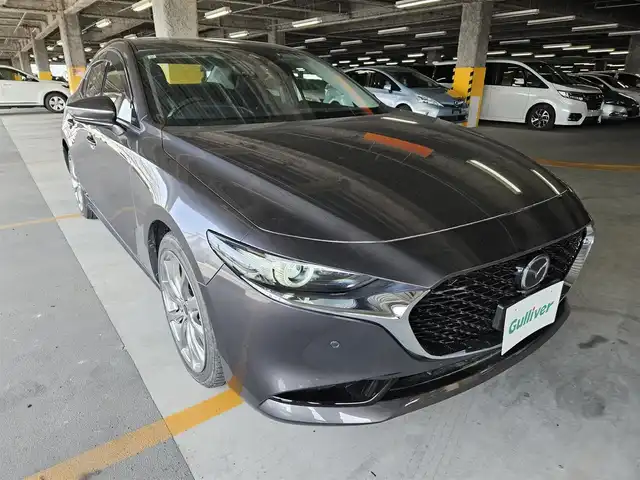 マツダ マツダ３セダン XD Lパッケージ 宮崎県 2019(令1)年 3.6万km マシーングレープレミアムM 純正8.8型ナビ(BT/CD/DVD)/フルセグTV/360度ビューモニター/全車速追従機能付レーダークルーズコントロール/パーキングセンサー/スマートブレーキサポート/AT誤発進抑制制御/クルージングトラフィックサポート/車線逸脱警報システム/レーンキーピングアシスト/前後側方接近車両検知/ブラインドスポットモニタリング/ドライバーアテンションアラート/交通標識認識システム/アクティブドライビングディスプレイ/ターボ/アダプティブLEDヘッドランプ/本革巻きステアリング/ステアリングヒーター/パドルシフト/ブラックパーフォレーション革シート/前席シートヒーター/運転席ドライビングポジションメモリー/バルミナ18インチアルミホイール/純正AWサマータイヤ積込/アドバンストキーレスエントリーシステム/禁煙車