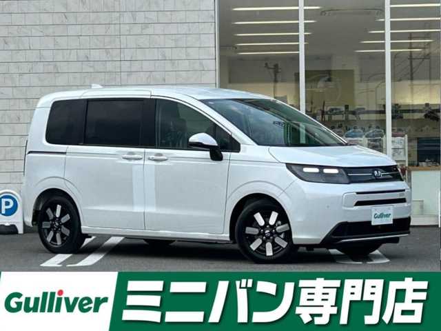 ホンダ フリード ハイブリット e:HEV AIR EX 福岡県 2025(令7)年 0.1千km プラチナホワイトパール 登録済未使用車HondaCONNECTナビバックカメラホンダセンシングコーナーセンサー両側パワスラBSMハーフレザーシートシートヒーターUSBポート純正LEDヘッドライト純正15インチアルミホイールスマートキープッシュスタート