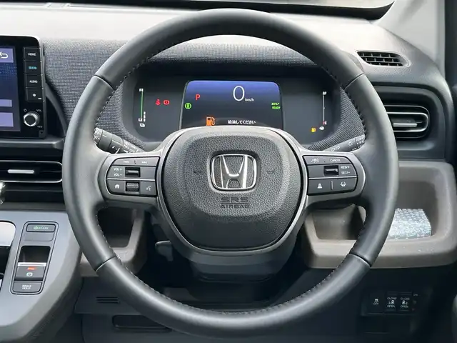 ホンダ フリード ハイブリット e:HEV AIR EX 福岡県 2025(令7)年 0.1千km プラチナホワイトパール 登録済未使用車HondaCONNECTナビバックカメラホンダセンシングコーナーセンサー両側パワスラBSMハーフレザーシートシートヒーターUSBポート純正LEDヘッドライト純正15インチアルミホイールスマートキープッシュスタート