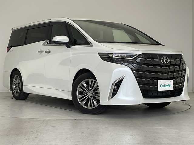 トヨタ アルファードハイブリット Z 愛知県 2024(令6)年 0.5万km プラチナホワイトパールマイカ 衝突軽減システム/純正１４型ディスプレイオーディオ（ナビあり）/フリップダウンモニター/三眼LEDヘッドライト/全方位カメラ/両側パワースライドドア/ガラスルーフ/レーダークルーズコントロール/シートヒーター/エアシート/フルセグ/Bluetooth/バックカメラ/電動リアゲート/パワーシート/ヘッドアップディスプレイ/コーナーセンサー/純正アルミホイール/ETC２．０/ブラインドスポットモニター/ステアリングヒーター/リアオートエアコン/オートマチックハイビーム/置くだけ充電器/ステアリングスイッチ/スマートキー/プッシュスタート