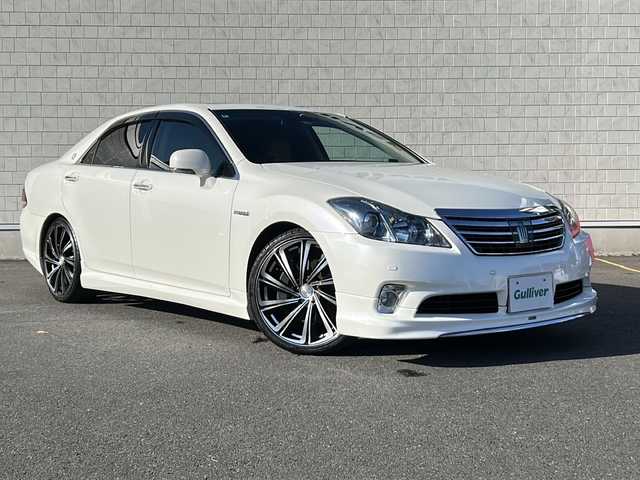 トヨタ クラウン ハイブリッド Gパッケージ 茨城県 2010(平22)年 7.8万km ホワイトパールクリスタルシャイン モデリスタフルエアロ/サンルーフ/純正HDDナビ/【フルセグTV/CD/DVD/HDD/ラジオ】/バック・サイドカメラ/レーダークルーズコントロール/ベージュ革シート/前席パワーシート/前席シートヒーター/エアーシート/運転席パワーシート/社外20インチAW/社外サスペンション/ビルトインETC/オートライト/純正フロアマット/純正ドアバイザー/プッシュスタート/スマートキー