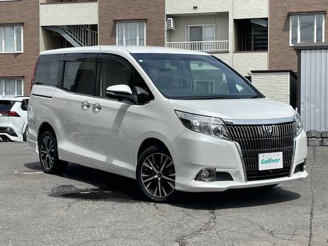 トヨタ エスクァイア Gi 道東・釧路十勝 2015(平27)年 7.9万km ホワイトパールクリスタルシャイン 4WD/7人乗り/寒冷地仕様/純正9インチメモリーナビ/  (DVD/CD/フルセグTV/Bluetooth)/全方位カメラ/黒革シート/前席シートヒーター/クルーズコントロール/LEDヘッドライト/フォグライト/オートマチックハイビーム/両側パワースライドドア/ウッドコンビハンドル/ステアリングリモコン/リアオートエアコン/ETC/ウィンカーミラー/電動格納ミラー/アイドリングストップ/横滑り防止装置/純正フロアマット/純正ドアバイザー/リアアンダースポイラー/純正エンジンスターター/スマートキー/エンジンプッシュスタート/スペアキー/取扱説明書/保証書/ナビ取説/社外17インチアルミホイール