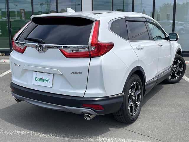 ホンダ ＣＲ－Ｖ EX 道東・釧路十勝 2022(令4)年 0.8万km プラチナホワイトパール ・４WD/・純正SDメモリナビ/（ＳＤ・ＣＤ・ＤＶＤ・フルセグ・ＡＭ・ＦＭ・ＢＴ）/・バックカメラ/・レーダークルーズコントロール/・純正エンジンスターター/・ホンダセンシング/・ステアリングヒーター/・革巻きステアリング/・パドルシフト/・横滑り防止装置/・レーンキープアシスト/・運転席パワーシート/・メモリーシート/・前席シートヒーター/・ヒーテッドドアミラー/・電動格納ミラー/・ドアバイザー/・純正フロアマット/・スマートキー/・プッシュスタート/・ブラインドスポットモニター/・社外アルミホイール付冬タイヤ積込