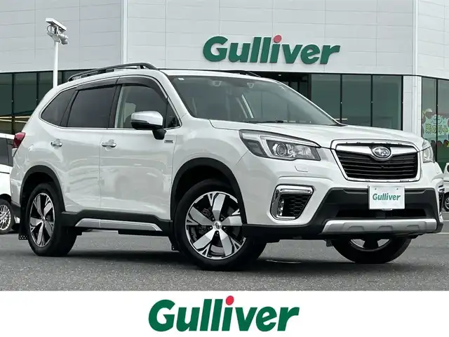 スバル フォレスター ハイブリッド アドバンス 島根県 2019(令1)年 7.1万km クリスタルホワイトP 純正8インチナビ/(AM/FM/CD/DVD/SD/Bluetooth)/フルセグTV/アイサイトVer.3/衝突軽減ブレーキ/レーンキープアシスト/レーダークルーズコントロール/アイサイトセイフティプラス/・スマートリヤビューミラー/・フロント＆サイドビューモニター/・スバルリヤビークルディテクション/ステアリング連動ヘッドライト/LEDヘッドライト/ルーフレール/マッドガード/ビルトインETC2.0/全席シートヒーター/ステアリングヒーター/純正18インチAW/スマートキー/スペアキー×1/プッシュスタート/純正フロアマット/ドアバイザー