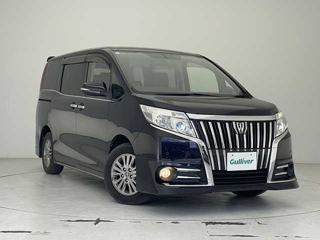 トヨタ エスクァイア Gi 沖縄県 2015(平27)年 6.5万km スパークリングブラックパールクリスタルシャイン 純正９型ナビ　【NSZT-Y64T】/　(フルセグTV Bluetooth CD/DVD)/バックカメラ/純正１１型フリップダウンモニター　/両側パワースライドドア　/ＬＥＤヘッドライト　/クルーズコントロール　/前席シートヒーター　/純正１５インチアルミホイール/プッシュスタート/スマートキー/スペアキー/純正フロアマット/ETC