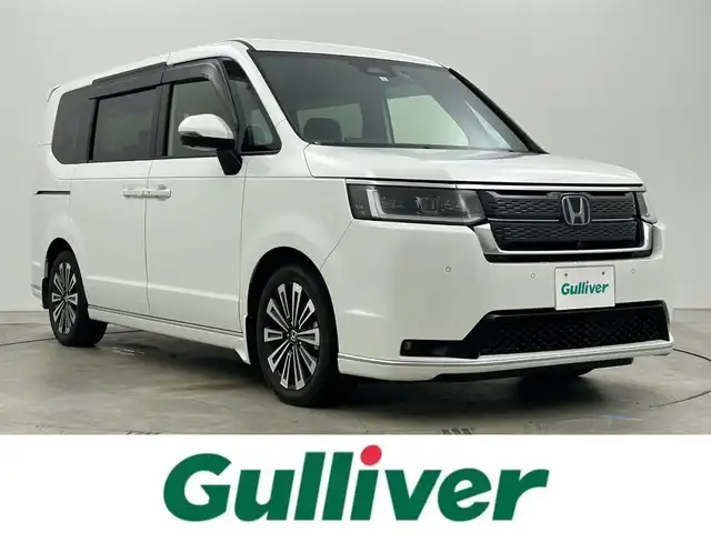 ホンダ ステップワゴン スパーダ eHEV プレミアムライン 岡山県 2023(令5)年 1.1万km プラチナホワイトパール 純正11.4インチナビ/地デジ/Bluetooth/DVD/CD/SD/Carplay/全方位カメラ/純正10インチフリップダウンモニター/両側パワースライドドア/ハーフレザーシート /シートヒーター /LEDヘッドライト/コーナーセンサー /パワーバックドア /ホンダセンシング /アダプティブクルーズコントロール/ビルトインETC2.0/純正前後ドライブレコーダー /オットマン/パドルシフト/スマートキー/スペアキー×１