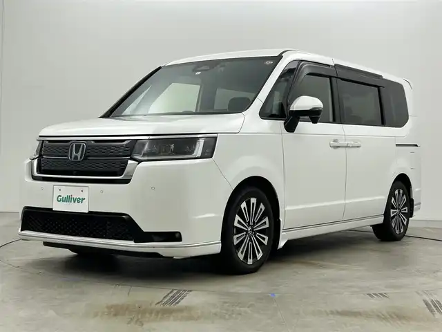 ホンダ ステップワゴン スパーダ eHEV プレミアムライン 岡山県 2023(令5)年 1.1万km プラチナホワイトパール 純正11.4インチナビ/地デジ/Bluetooth/DVD/CD/SD/Carplay/全方位カメラ/純正10インチフリップダウンモニター/両側パワースライドドア/ハーフレザーシート /シートヒーター /LEDヘッドライト/コーナーセンサー /パワーバックドア /ホンダセンシング /アダプティブクルーズコントロール/ビルトインETC2.0/純正前後ドライブレコーダー /オットマン/パドルシフト/スマートキー/スペアキー×１