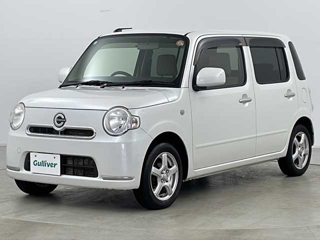 ダイハツ ミラ ココア X 道央・札幌 2013(平25)年 3.8万km パールホワイトⅢ ・4WD/・社外ナビ　TV＆DVD＆CD/・バックカメラ/・エコアイドル/・スマートキー/・電動格納ドアミラー/・ドアミラーヒーター/・オートエアコン/・社外14インチアルミホイール/・社外13インチアルミ付冬タイヤ積込