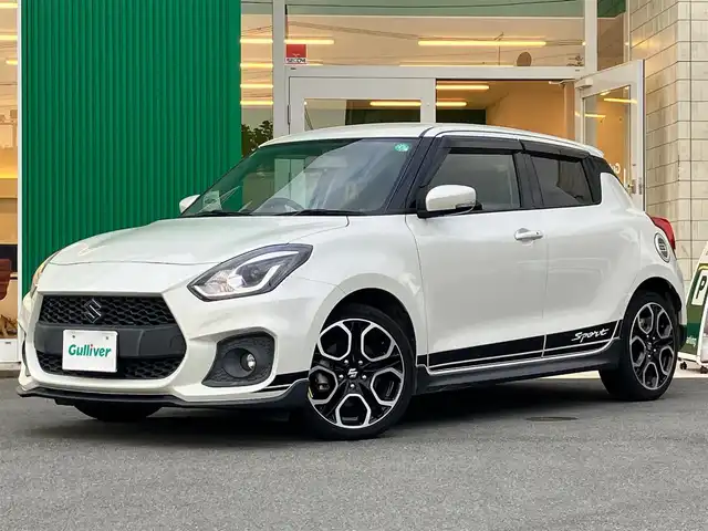 スズキ スイフト スポーツ 静岡県 2019(令1)年 5.7万km ピュアホワイトP 純正8インチナビ(CD/DVD/フルセグ/BT)/バックカメラ/クルーズコントロール/ドライブレコーダー/ETC/オートライト/LEDヘッドライト/フォグライト/純正フロアマット/ISOFIX対応/純正17インチアルミホイール/スマートキー/スペアキー1本/ドアバイザー/ステアリングスイッチ/横滑り防止装置/プッシュスタート/パワーステアリング/パワーウィンドウ/盗難防止装置